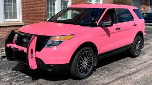 an electric pink suv