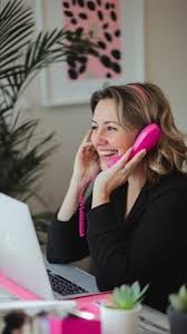 an office woman on a pink phone