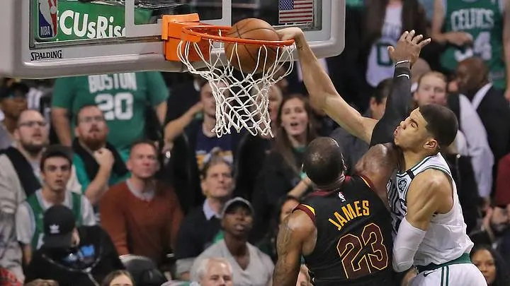 Jayson Tatum dunking over LeBron James