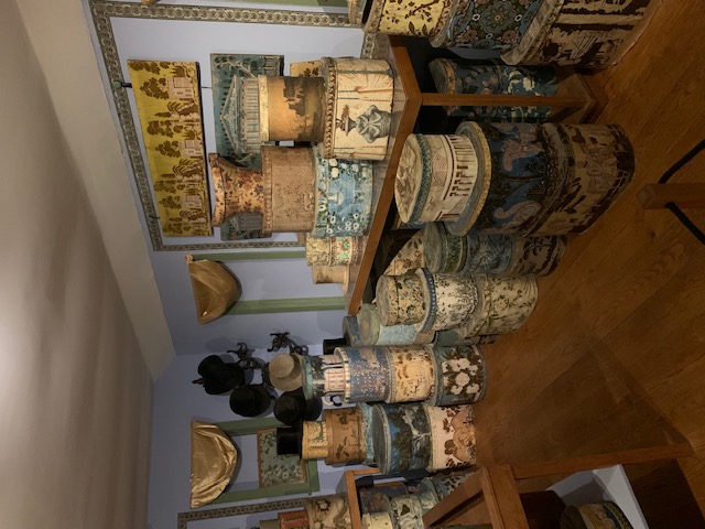 Vintage and antique bandboxes in a blue room