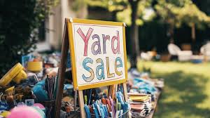 This is a picture of a yardsale sign.