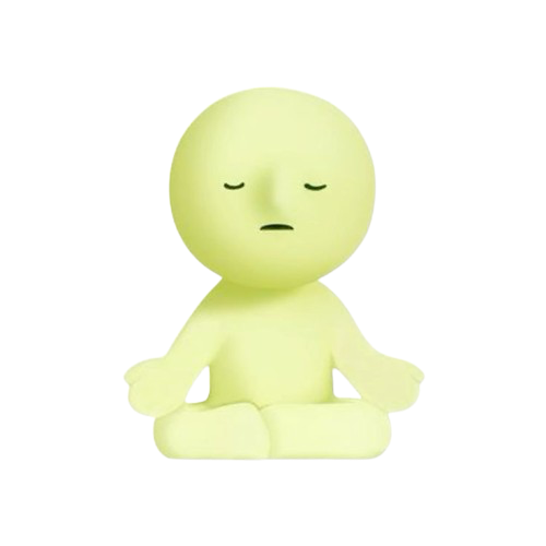 small green figure sitting criss cross