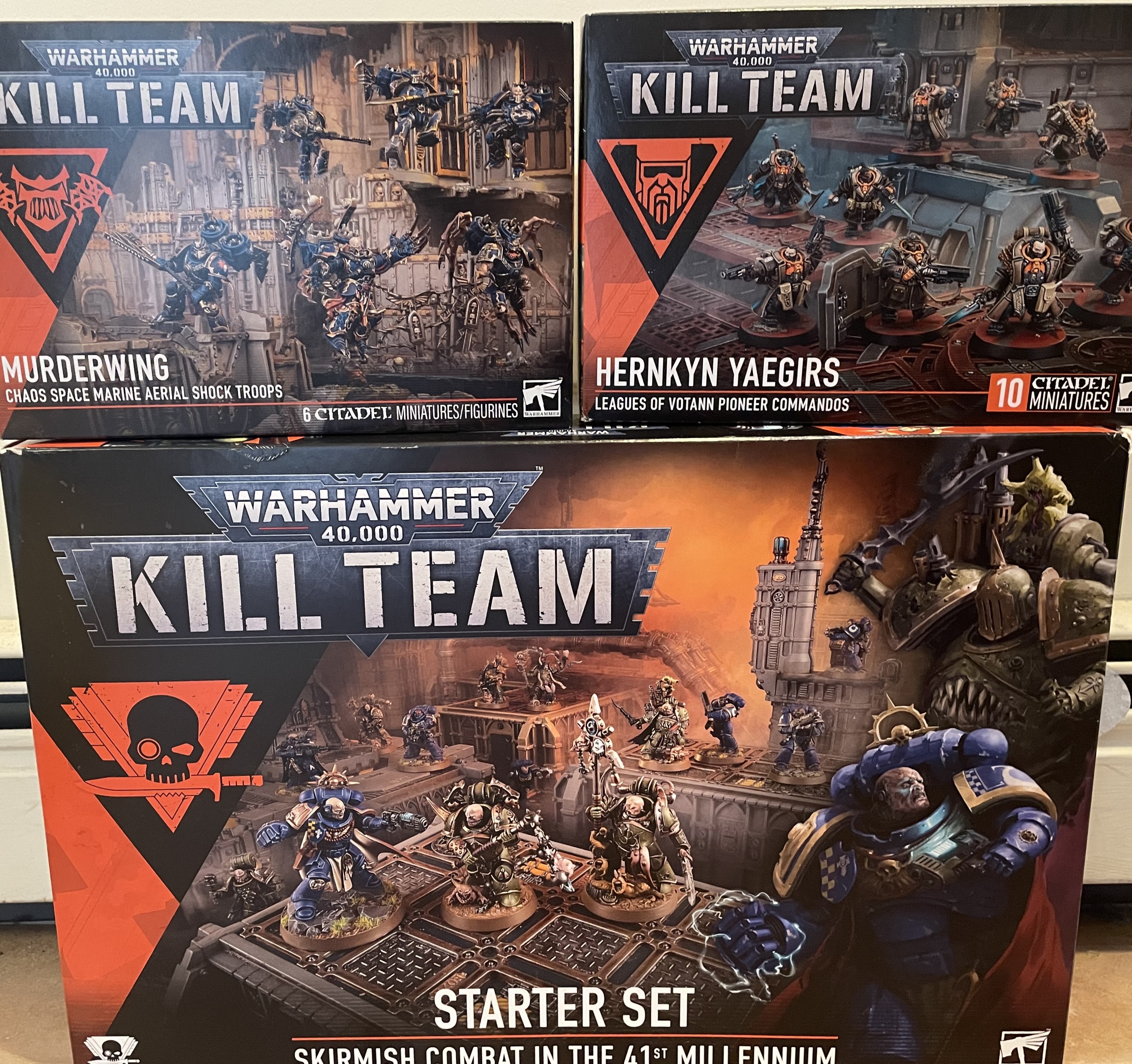 A Pile of 3 Kill Team Boxes