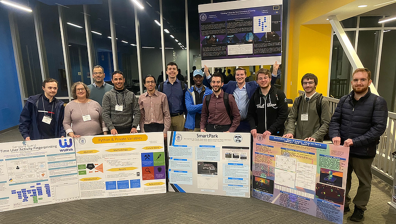 Students at CCSCNE standing w/ their posters