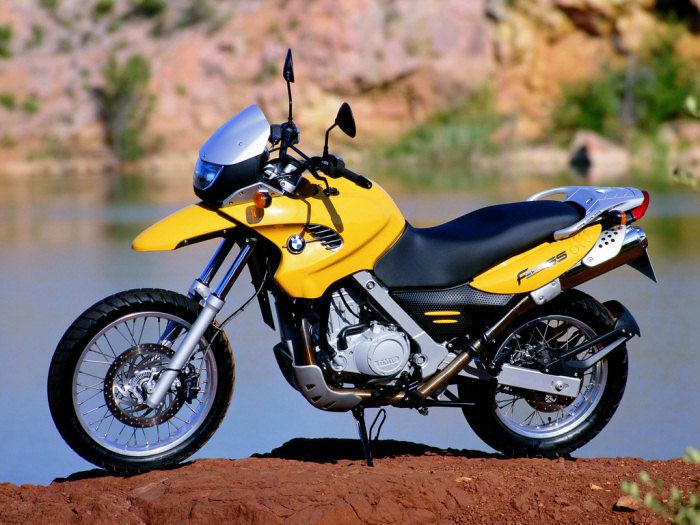 A beautiful yellow BMW motorcycle.